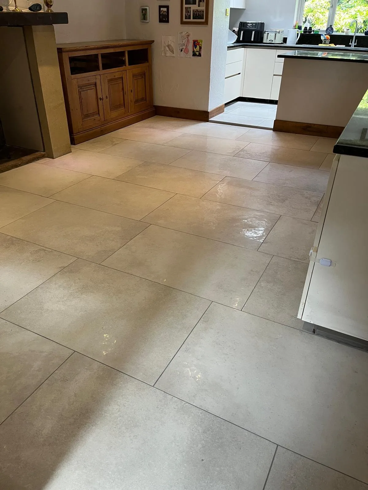 Cream limestone-effect large-format kitchen floor tiles